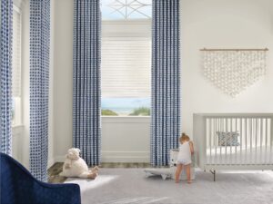 Floor to ceiling window in a child's room with Sonnette Cellular Roller Shades installed