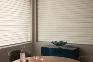 Dining room with two windows with Designer Banded Shades installed