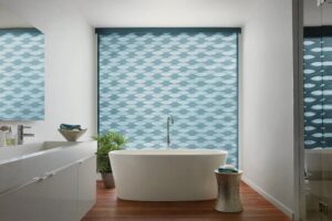 Bathroom with big bathtub in front of window with Designer Banded Shades installed