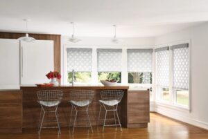 Fuve windows in a dark coloured kitchen with Designer Roller Shades installed