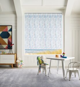 Kids play room with a window that has Designer Roller Shades installed