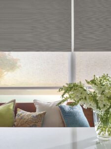 Windows above a bench in a kitchen with Designer Roller Shades installed