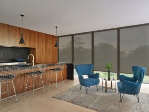 Large kitchen with floor to ceiling windows with Designer Roller Shades installed
