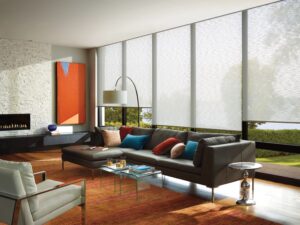 Living room with section and floor to ceiling windows with Designer Roller Shades installed