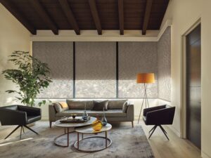 Sitting room with wrap around windows with Designer Roller Shades installed