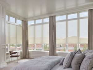 Bedroom with 3 large windows adorned with Designer Screen Shades