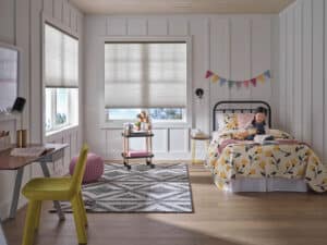 Bright child's room with Hunter Douglas Applause honeycomb shades in the background