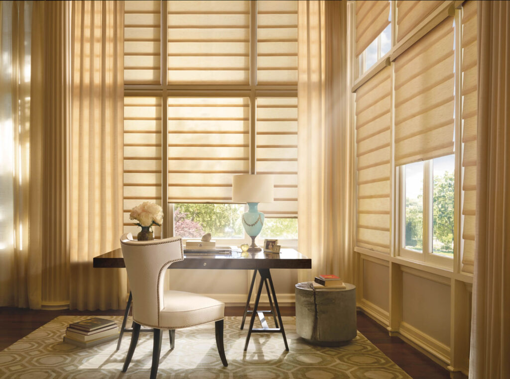 Beige Hunter Douglas Roman Shades installed on the windows in the office