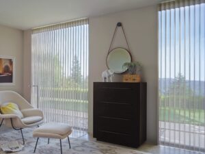 Bedroom with dresser between two windows covered with Luminette Privacy Sheers
