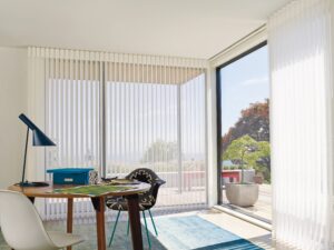 Den with office desk and windows covered with Luminette Privacy Sheers