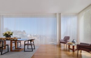 Dining room with table in front of window with Luminette Privacy Sheers