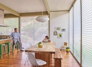 Large wood table in kitchen with Nantucket Window Shadings