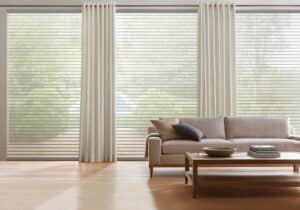 White couch in from of window with Nantucket Window Shadings