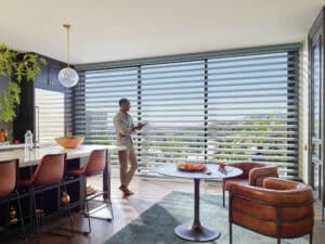 Man in kitchen with Pirouette® Sheer Shades
