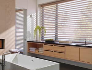 Bathroom counter with window covered in Pirouette® Sheer Shades