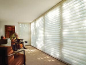 Family room with big bay window covered with Silhouette® Window Shadings