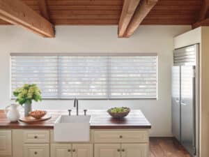 Decorated kitchen counter with windows accented with Silhouette® Window Shadings