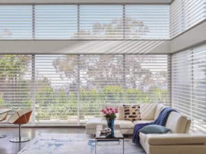 Designer sectional in living room and windows decorated with Silhouette® Window Shadings
