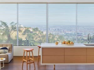 Stool in kitchen with windows covered with Silhouette® Window Shadings