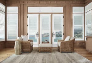 Living room with French Doors with Palm Beach Polysatin Shutters installed