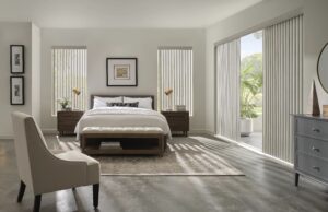 Bedroom with big patio door with Cadence Soft Vertical Blinds installed