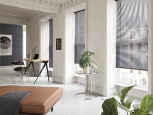 Modern office with desk and chair and three windows with Modern Precious Metals Venitian Blinds installed