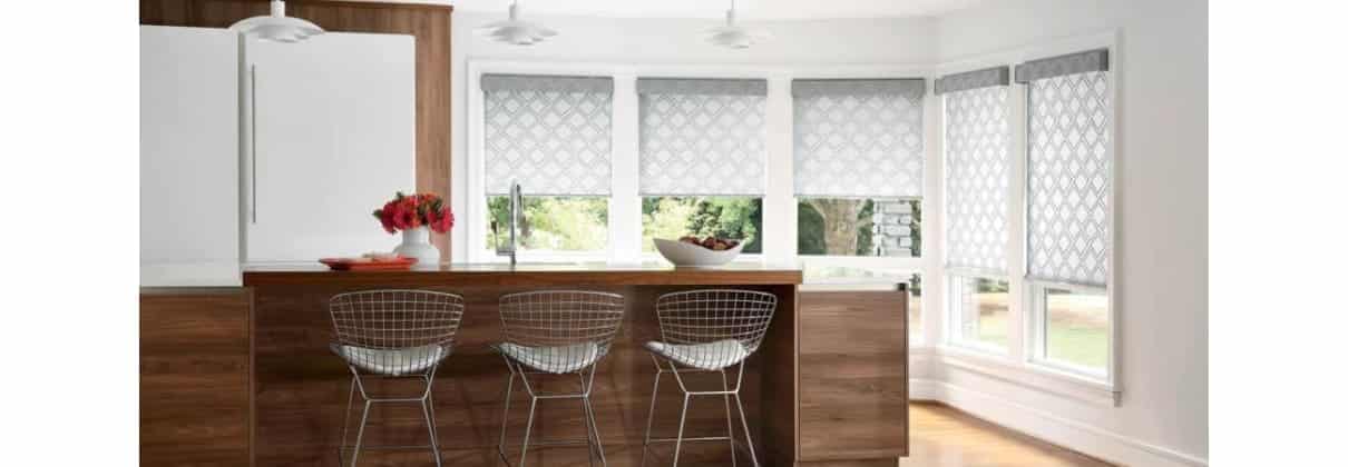 A kitchen with window blinds.