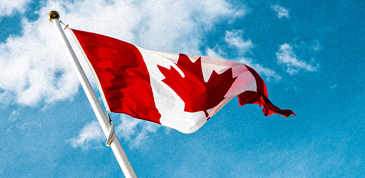 Canadian flag waving in the sky